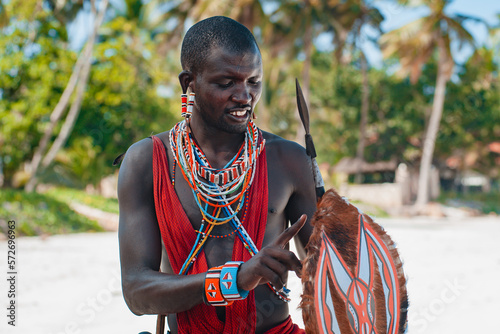 Maasai warrior on the beach Diani Beach, Kenya Mombasa