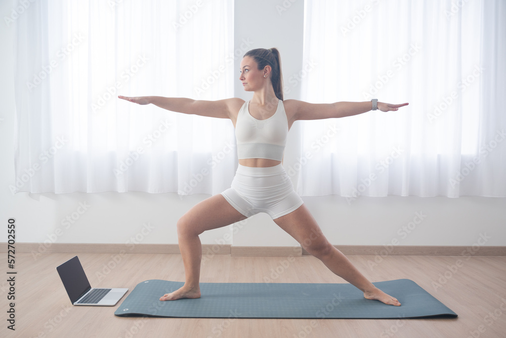 Young woman making yoga exercise
