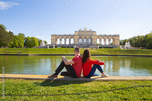 Beautiful sunny day, Sch nbrunn Palace, residence in Vienna, Austria. A girl and a guy are sitting near the fountain. photo