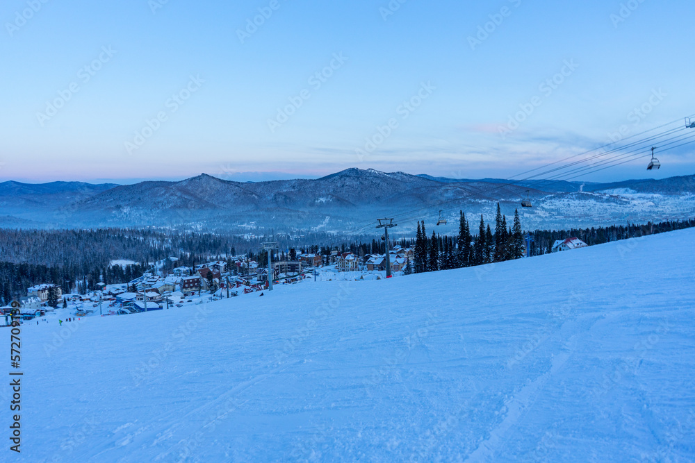 evening at the ski resort, empty ski lift and slope