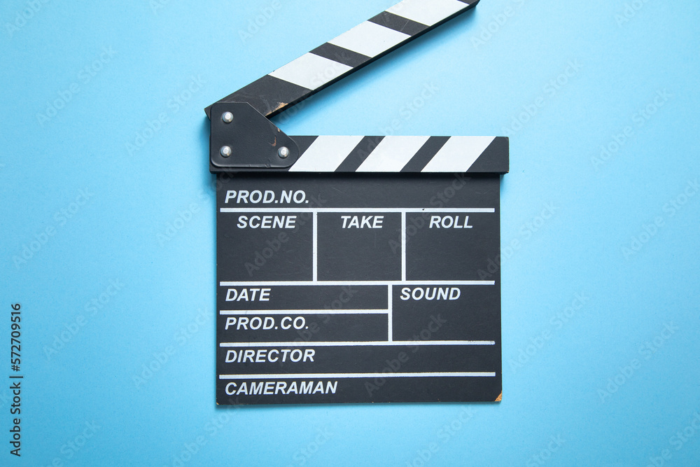 Movie clapper on the blue background.