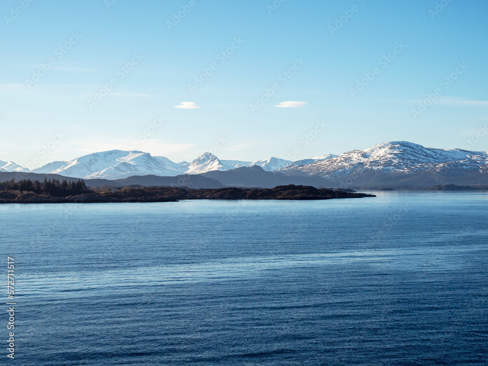 Snow covered mountains on the coast of Norway