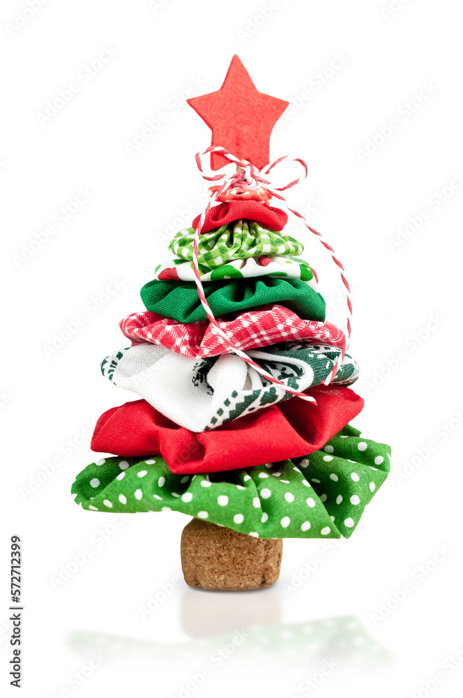 Christmas tree made of multi-colored fabric.Christmas and New Year. Isolate with shadow and reflection.