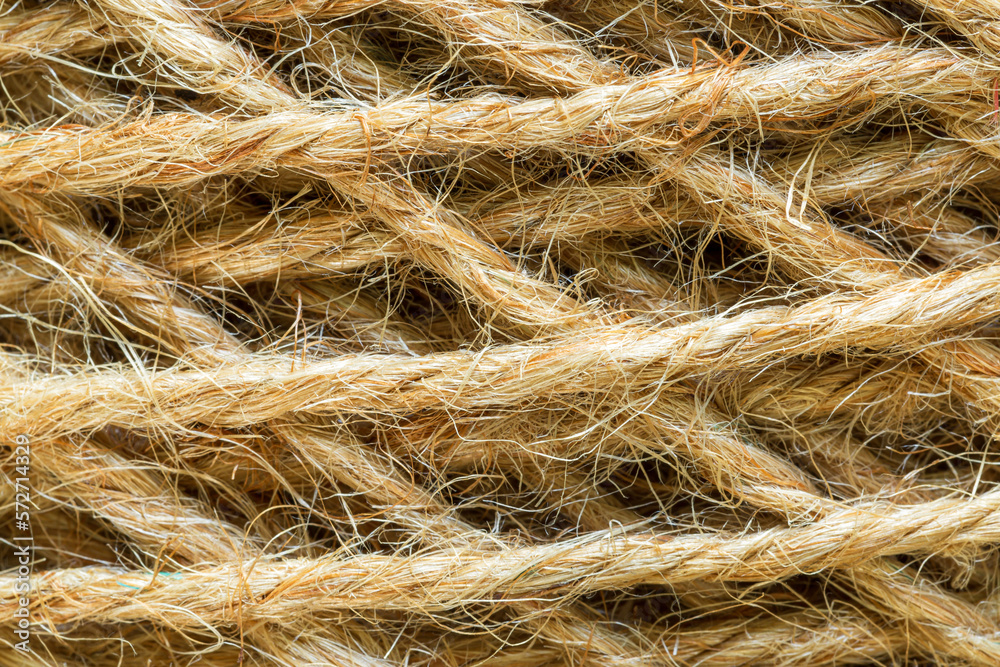 Natural made macro rope texture,Coarse rope made of natural fiber material - sisal plant. Macro photo of texture, background Natural made macro rope texture,Coarse rope made of natural fiber material - sisal plant. Macro photo of texture, background