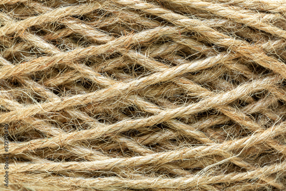 Natural made macro rope texture,Coarse rope made of natural fiber material - sisal plant. Macro photo of texture, background Natural made macro rope texture,Coarse rope made of natural fiber material - sisal plant. Macro photo of texture, background