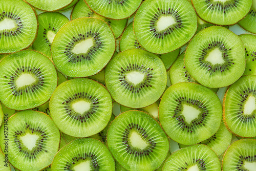 macro kiwi,Fresh Kiwi fruit sliced use for background,slice of kiwi fruit on a full frame. horizontal format