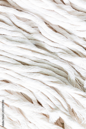 macro white rope background,The turns of the white twisted nylon ship rope close up