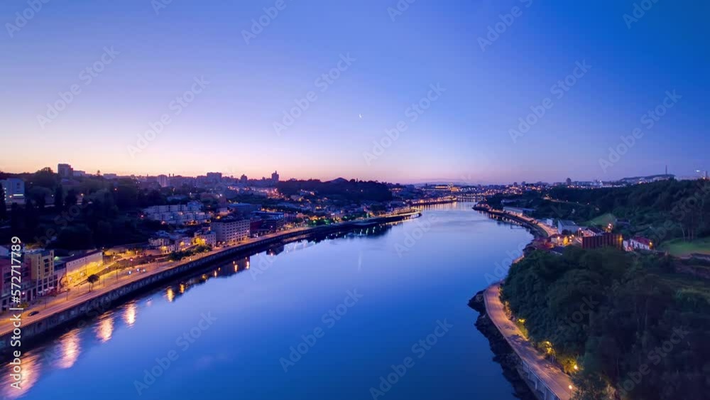 Aerial panoramic view before sunrise at the most emblematic area of Douro river timelapse night to day transition. World famous Porto wine production area.