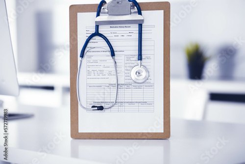 Fototapeta Naklejka Na Ścianę i Meble -  Stethoscope and clipboard with medication history records are on the table at the doctor's working place. Medicine and health care concept