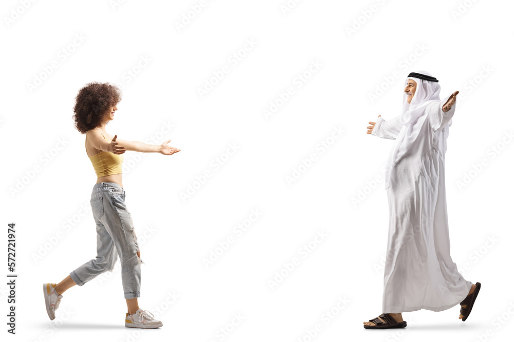 Happy arab man and a young casual woman walking towards each other with arms open