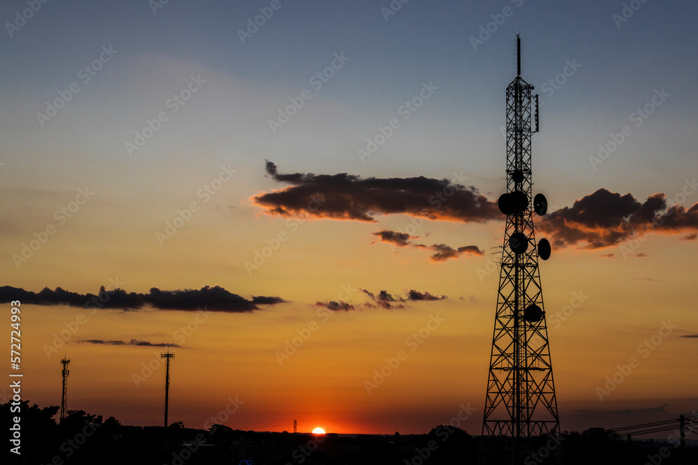 Silhouette of a telecommunications antenna in Brazil during a sunset