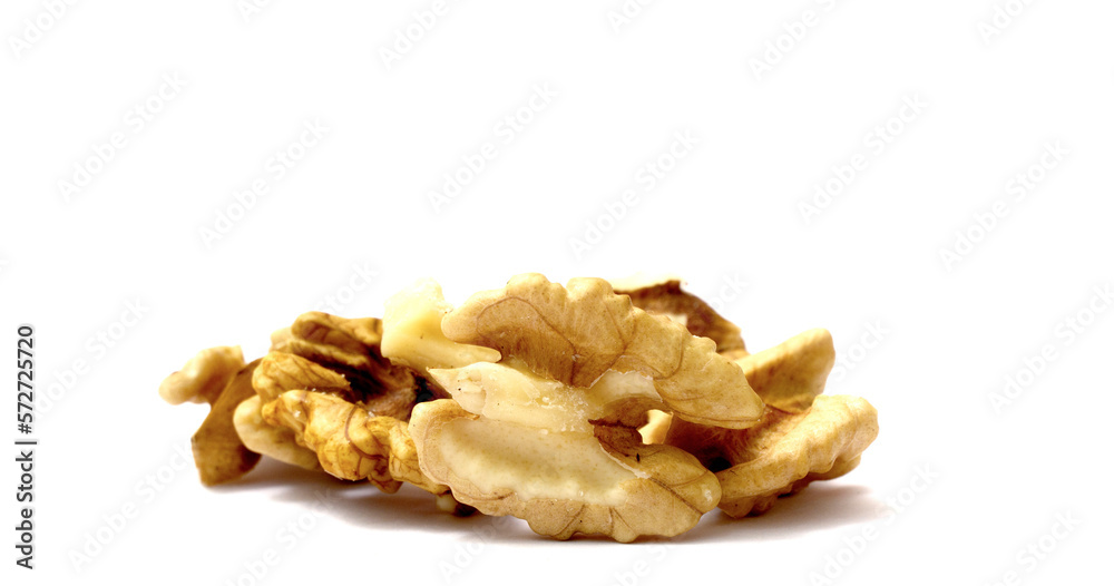 Pieces of a Peeled walnuts on white background.