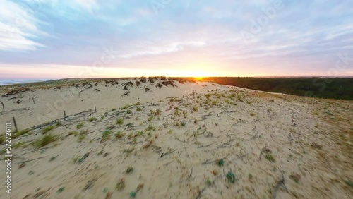 FPV drone shot sunrise france sand beach with waves