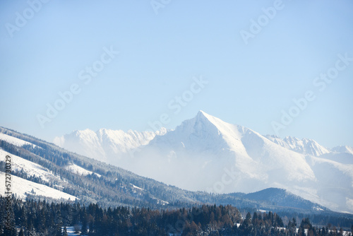 Symbol of Slovakia - peak Krivan from Haj-Nicovo near Liptovsky Mikulas in winter with snow. Slovakia, Liptov region. Snowy mountains.