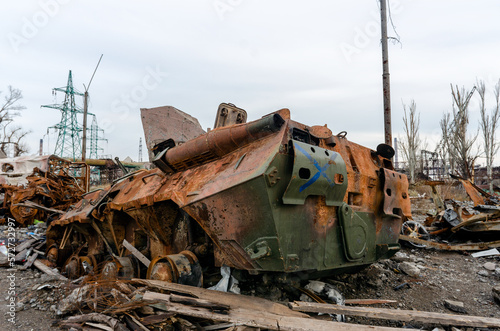 burnt tank and destroyed buildings of the Azovstal plant shop in Mariupol