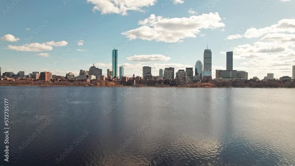 Drone and aerial establishing moving shot towards high-rise skyscrapers, tall apartments, and business developments in downtown Boston, Massachusetts on a sunny, winter day near the Charles River Drone and aerial establishing moving shot towards high-rise skyscrapers, tall apartments, and business developments in downtown Boston, Massachusetts on a sunny, winter day near the Charles River