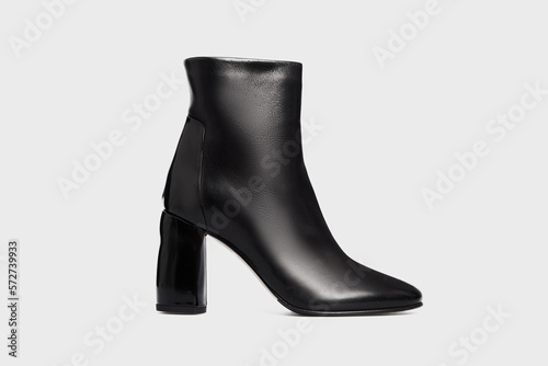 Valokuvatapetti Black women's fashion leather high heel ankle boot isolated on white background