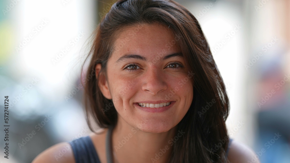 Portrait of a happy woman with dimples smiling at camera closeup face. 30s female person outside