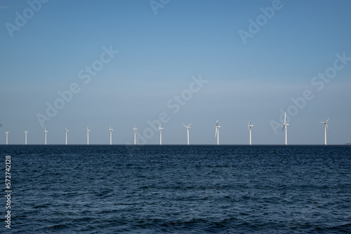 Horizontal shot of an offshore windpark in the baltic sea close to Amager beach in Copenhagen