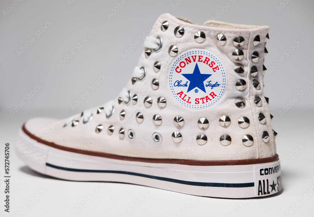 KENT, UK, 01.01.2023 studded metal converse Women's Chuck Taylor All Star  Hi Top Sneaker Top Chuck Taylor trainer shoes. Famous iconic classic converse  hi top sneakers on a white background. Stock Photo
