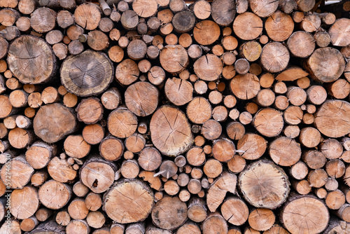 Wood logs stacked background flat with natural light for background