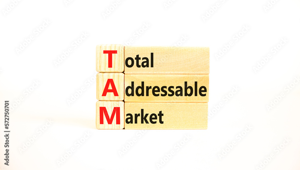 TAM total addressable market symbol. Concept words TAM total addressable market on wooden blocks on a beautiful white table white background. Business TAM total addressable market concept. Copy space. TAM total addressable market symbol. Concept words TAM total addressable market on wooden blocks on a beautiful white table white background. Business TAM total addressable market concept. Copy space.