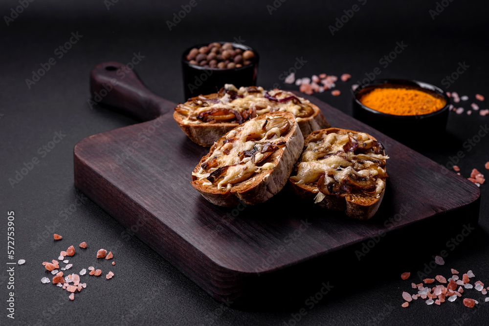 Fototapeta premium Delicious crispy toast or bruschetta with fried onion, champignon mushrooms and cheese