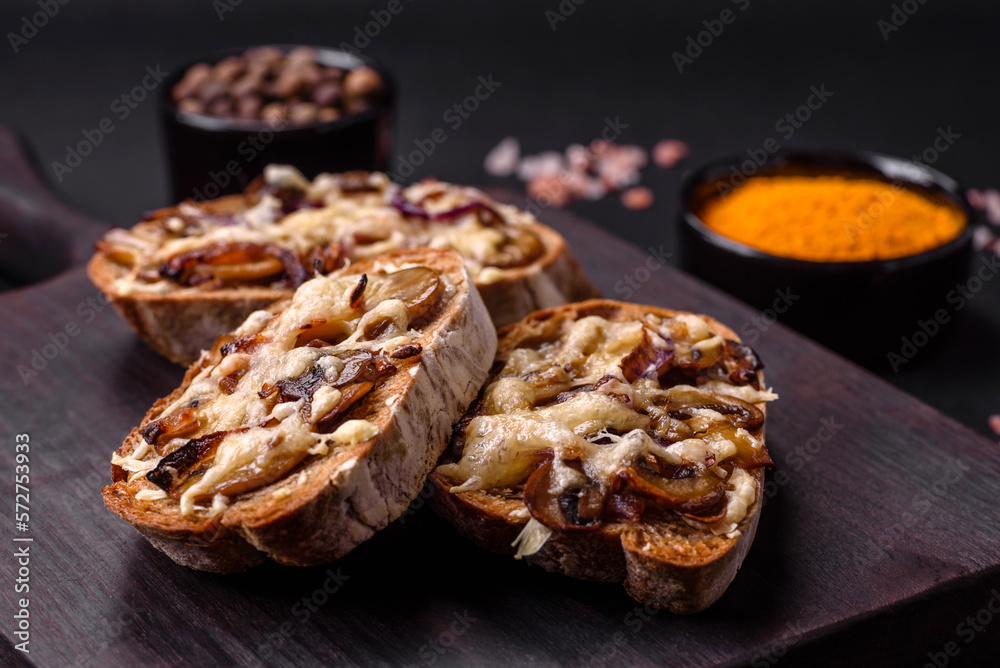 Delicious crispy toast or bruschetta with fried onion, champignon mushrooms and cheese Delicious crispy toast or bruschetta with fried onion, champignon mushrooms and cheese