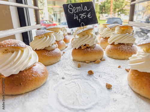 Delicious freshly baked semla or fastlagsbulle or laskiaispulla or vastlakukkel or fastelavnsbolle photo