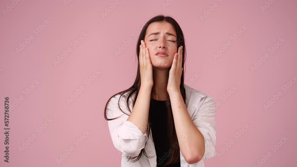 4k slow motion video of one girl having headache over pink background. 4k slow motion video of one girl having headache over pink background.