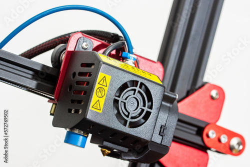 Very close-up detail of 3D printer printerhead with hotend and fan. Isolated on white background.