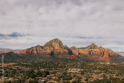 Sunset viewpoint in Sedona Arizona as seen from Airport Mesa Vortex looking towards both sides of town with lovely clouds and red rock mountain cliffs