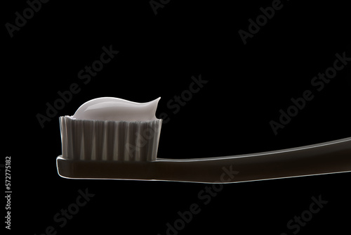 White toothbrush with toothpaste isolated on black photo