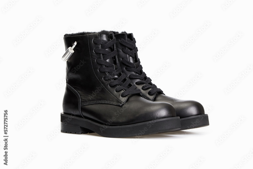 Black men's classic leather ankle boots isolated on white background. Business formal male polished glossy shoes. Winter boots for man with fur inside. Single. Template, mock up