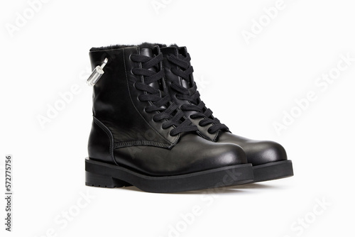 Black men's classic leather ankle boots isolated on white background. Business formal male polished glossy shoes. Winter boots for man with fur inside. Single. Template, mock up