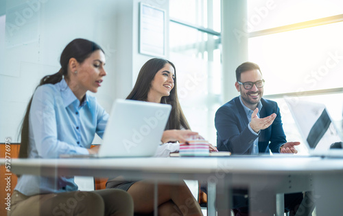 Through glass view of confidence business people having a meeting in conference room. © Bojan