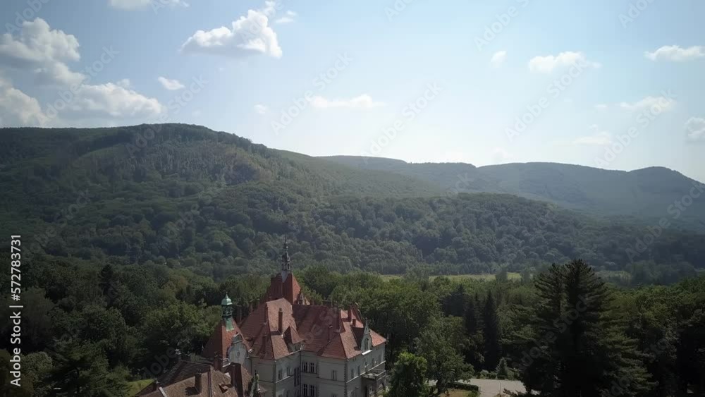 A beautiful old European castle among the green mountains A beautiful old European castle among the green mountains
