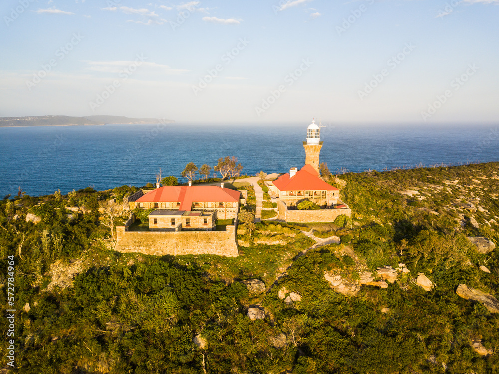 Another perspective of Barrenjoey head of Sydney Pacific coast with the lighthouse overlooking palm beach on a sunny day.