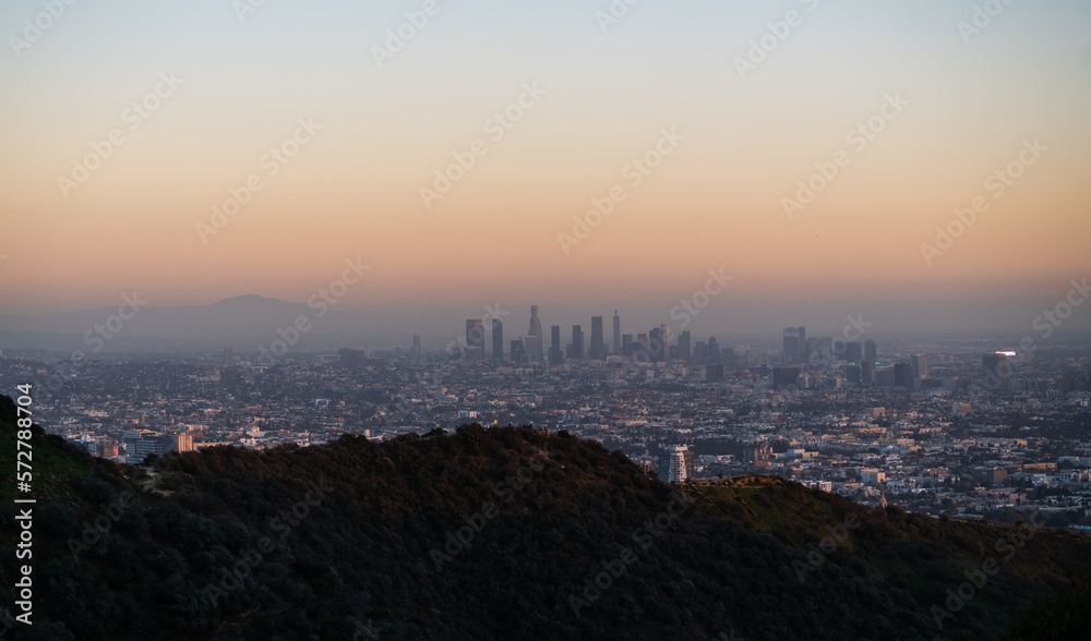 Skyline view of Los Angeles in the distance after sunset. Skyline view of Los Angeles in the distance after sunset.