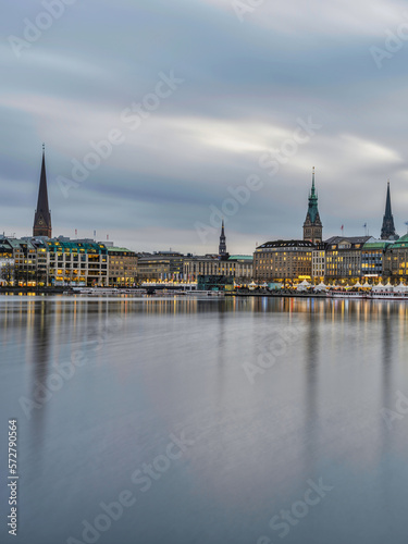 Hamburg city centre on lake Binnenalster after sunset with street lights, Germany
