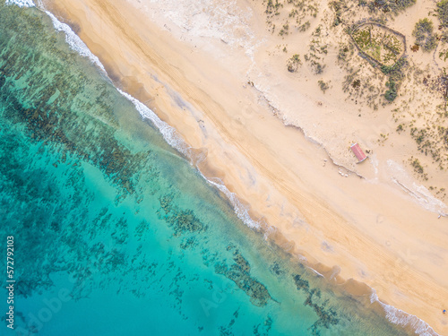 Bird's eye view of Porto Santo beach. Crystal clear waters and golden sand. "Casa da lancha" in the dunes.