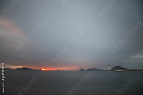 Seascape at sunshine. Lighthouse and sailings on the coast. Seaside town of Turgutreis and spectacular sunshine. Long Exposure shoot. tranquility scene. © bt1976