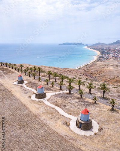 Old windmill at Porto Santo Island, located at portela. Drone shot facing south coast of the island and beach. photo