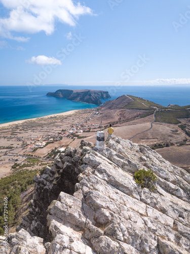 Traveler standing at Porto santo Island - Pico de Ana Ferreira on a sunny summer day - Ilhéu de baixo and desertas islands on the background photo