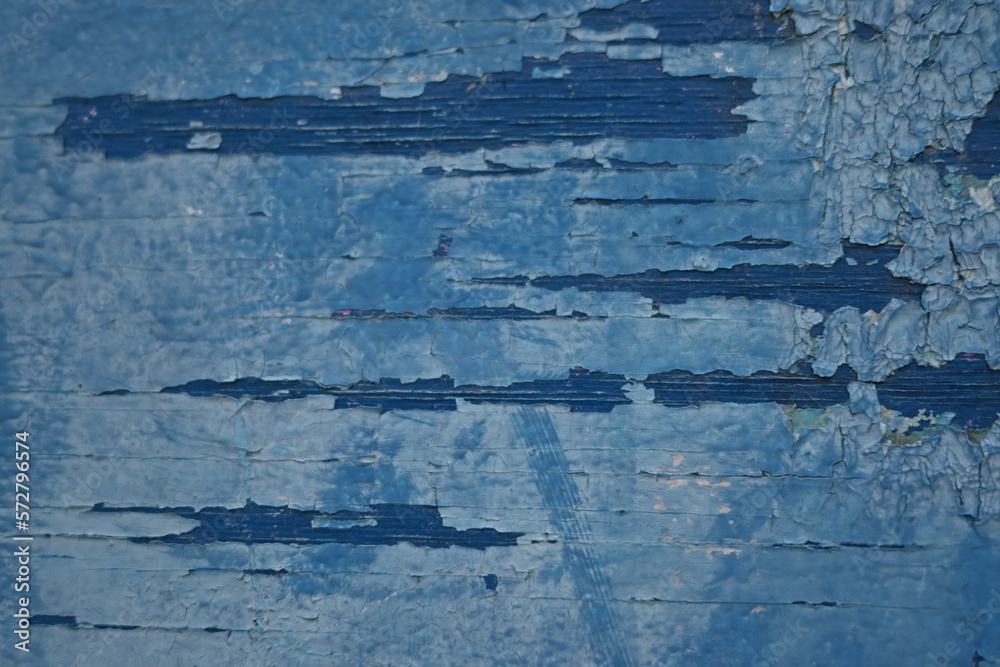 abstract texture of cornflower peeling paint on a wooden surface, azure groundwork for a banner, blue background for a poster, painted navy texture of a bench, wooden texture of an old tree white old 