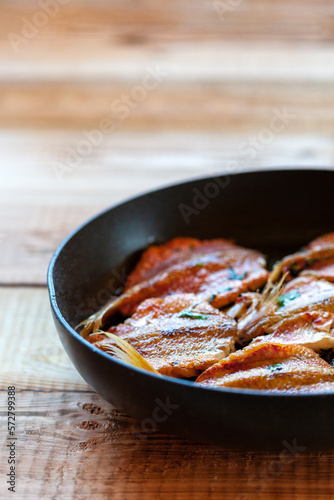 Red mullet fish cooked on a pan, vertical photo