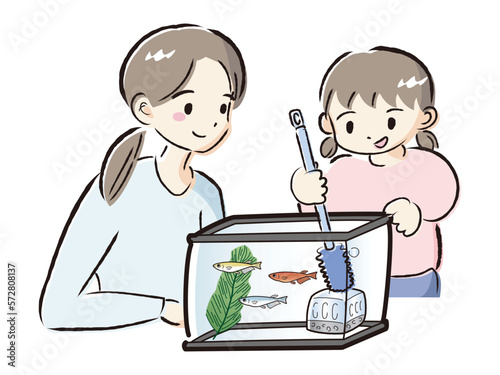 メダカのお世話をする親子（水槽の掃除）