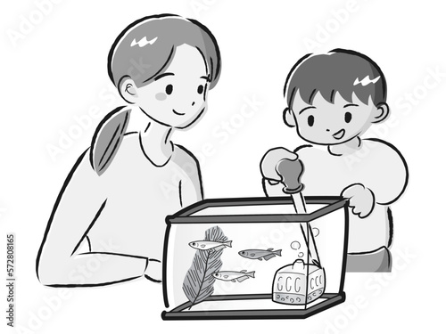 メダカのお世話をする親子（水換え）