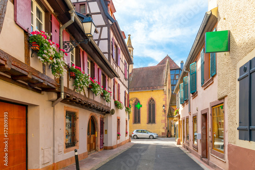 One of the many picturesque and colorful streets and alleys in the medieval village of Ribeauville, in the Alsace wine region of Northeast France.
