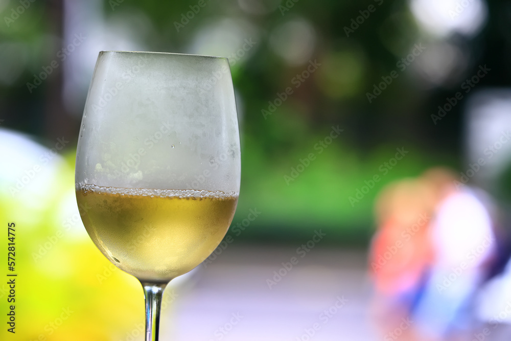 a glass of white wine in a restaurant, alcohol luxury background a glass of white wine in a restaurant, alcohol luxury background